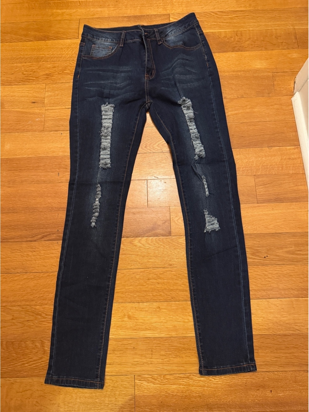 Dark washed ripped distressed denim skinny jeans
